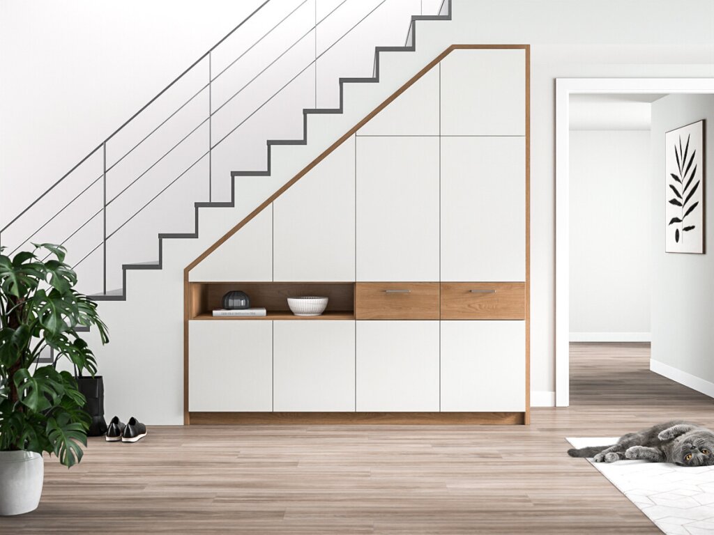 Ein Treppenschrank in Weiß mit Holzdekor.